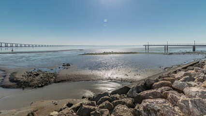 Motion from the low to high tide next to Vasco da Gama Bridge in Parque das Nacoes timelapse in...