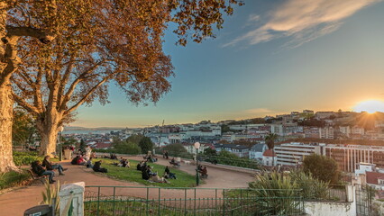 Panorama showing Jardim do Torel timelapse with views to the city center of Lisbon during sunset. Portugal
