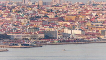 Aerial view of Lisbon skyline around Santos district, docks and the Tagus River timelapse. Lisbon,...