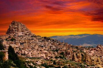 Fototapeta na wymiar Cappadocia Uhisar Castle is a magnificent view at sunset. Nevsehir,Turkey. 