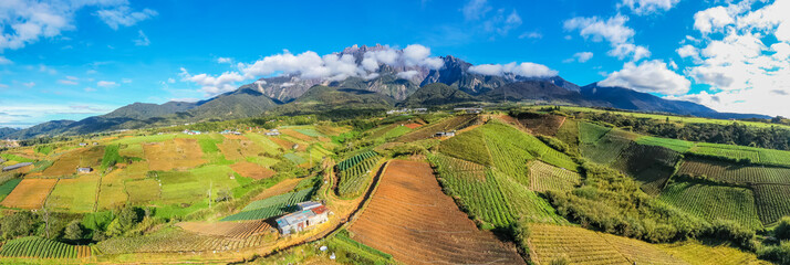 aerial view of Kundasang Sabah landscape with cabbage farm and Mount Kinabalu at far background...