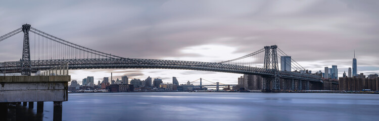 Williamsburg Bridge in New York City, a historic suspension bridge connecting Manhattan and...