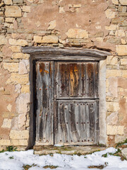 Wooden aged antique door of an European rural village. - 736223896
