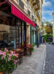 Cozy street with tables of cafe in quarter Montmartre in Paris, France. Cozy cityscape of Paris. Architecture and landmarks of Paris. - 736234406