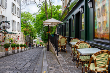 Cozy street with tables of cafe in quarter Montmartre in Paris, France. Cozy cityscape of Paris. Architecture and landmarks of Paris. - 736237250