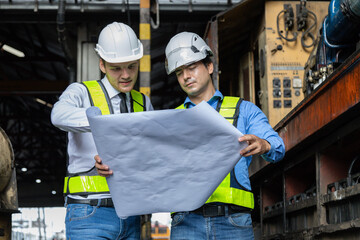 Engineer train Inspect the train's diesel engine, railway track in depot of train