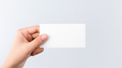 Young child hand holding some like a blank card isolated on a white background