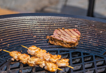 kebabs and meat on the grill.
