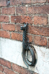 Fototapeta premium Iron ring on the building's wall in Siena, Italy