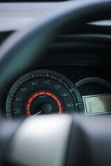 Closeup car fuel gauge dashboard panel. Gasoline indicator meter and speedometer. Fuel gauge show...