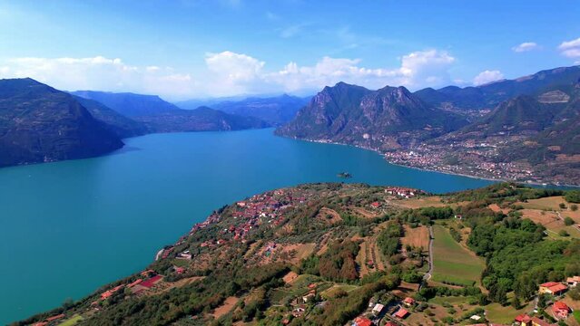 Italian lakes scenery. Iseo lake . Aerial drone view of beautiful Monte Isola island and Peschiera Maraglio village. Italy, Brescia province
