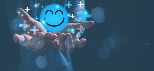 Mental health positive thinking and growth mindset. Hands holding blue happy smile face icon good feedback rating, positive customer review, experience, satisfaction survey, smiley mental health.