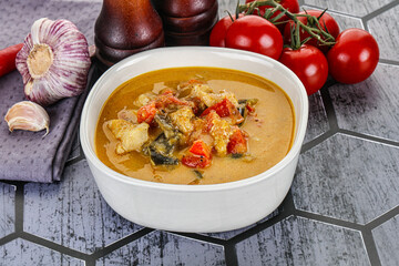 Traditional yellow Thai curry with chicken