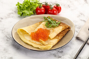 Russian pancake with red caviar