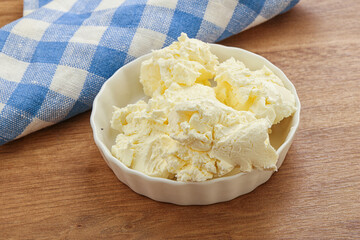 Italian soft mascarpone cheese in the bowl