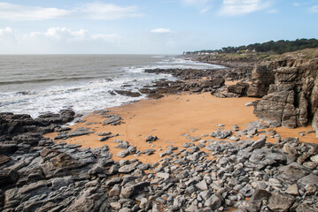 Beautiful seaside landscape from a drone, rocky sandy coast on the Atlantic Ocean in France.