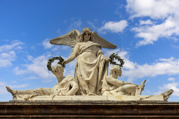 Catania, Sicily, Italy - April 30, 2023: Detail of decorative facade of baroque Teatro Massimo...