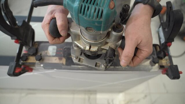 Closeup of a router for installing hidden hinges of interior doors