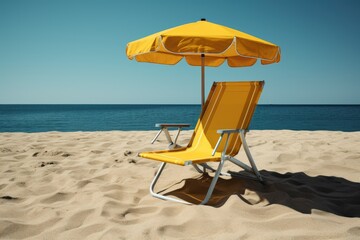 Inviting yellow beach chair and umbrella stand solitary on a pristine sandy beach, the calm ocean stretching to the horizon under a clear blue sky