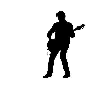 silhouette of a person with a guitar
