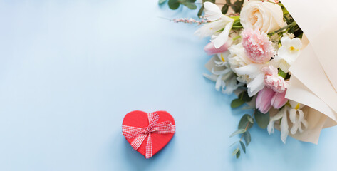 Beautiful bouquet and heart gift box