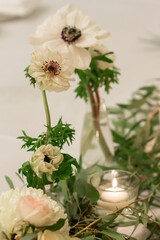 Festive table decoration with flowers and other elements