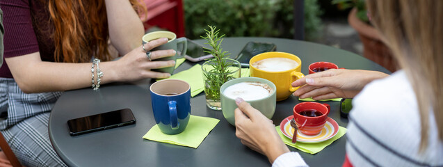 Horizontal banner or template with close-up of the table set for breakfast with cappuccino and...