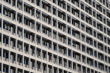 A grey façade of a high-rise building in the centre of berlin - 736344090