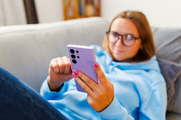 Relaxed Woman Browsing on Smartphone