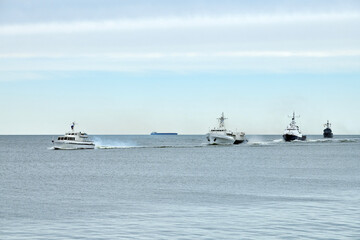 Flotilla of Russian warships sailing toward military target, armed warships ready for attack enemy...