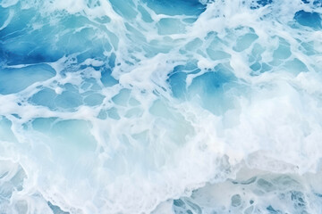 Blue sea water with foam as abstract background. Top view. Copy space
