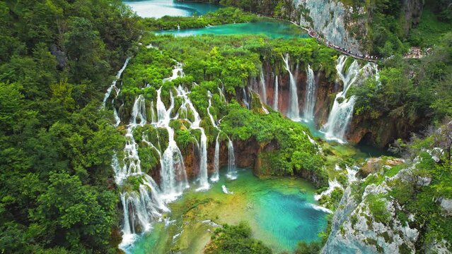 Epic waterfalls flow in green mountain forest. Emerald crystal clear spring water of lakes. National Park in Croatia.