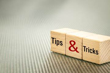 Tips and tricks symbol, Business words written on wooden blocks, Tips and tricks concept. Copy...