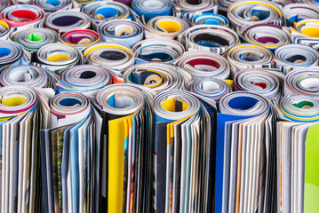 Group of rolled up paper magazines, closeup
