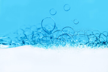 Cosmetic essence, transparent bubbles in white blue liquid. Cosmetic Emulsion, Serum, Hydration Skin Care Macro, scientific approach