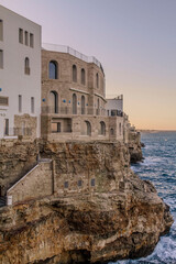 view of the walls of the city of Polignano a Mare, located on a slope on the Adriatic Sea widok na mury miasta Polignano a Mare, położonego na zboczu nad Morzem Adriatyckim