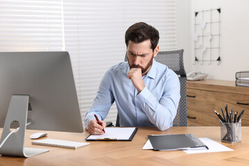 Fototapeta premium Sick man coughing at workplace in office. Cold symptoms