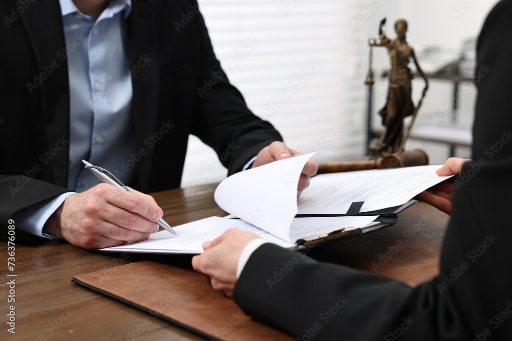 Poster Man signing document in lawyer's office, closeup