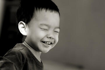 Happy  young boys playing hide and seek ,monochromatic tone and copy space