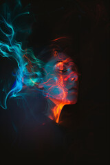 a portrait of a man using their imagination. represented in bright vibrant colors projected on their face and smoke. over a dark background