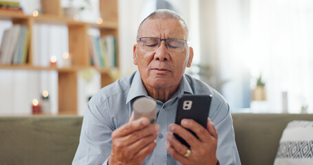 Phone, pills and senior man at home, reading label, medicine information and confused for telehealth service or FAQ. Elderly person on sofa with pharmaceutical bottle or tablet with mobile questions - obrazy, fototapety, plakaty