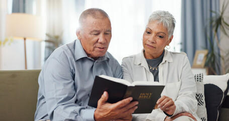 Senior, couple and home reading bible and talking of faith, god or helping with spiritual guide of...