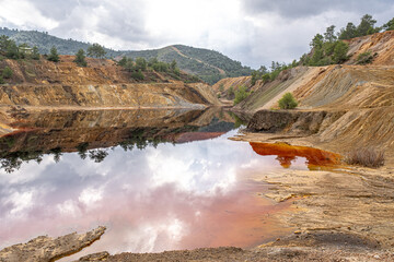 Red view of Sia Mine Red Lake, a former copper and pyrite mine excavation basin filled with water, ...