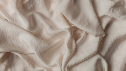 Silk fabric background of crumpled beige cloth