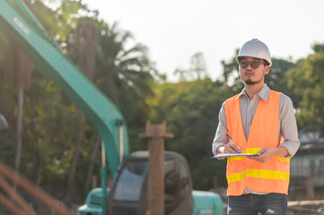 Construction engineer working on a bridge construction site over a river,Civil engineer supervising work,Foreman inspects work at a construction site