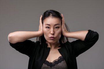 Japanese woman hears no evil