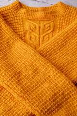 Handmade yellow knitting wool texture background