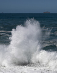 Big waves caused by the undertow crashing against the rocks at Rio de Janeiro, Brazil