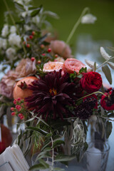 Set table at a wedding reception with floral centerpiece and candles