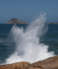 Big waves caused by the undertow crashing against the rocks at Rio de Janeiro, Brazil